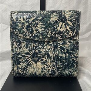 This is a Patricia Nash Reiti wallet in a sunflower print.